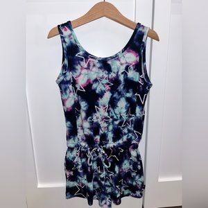 Pixie Lane blue, purple, navy tie dye with white outlined stars shorts romper.